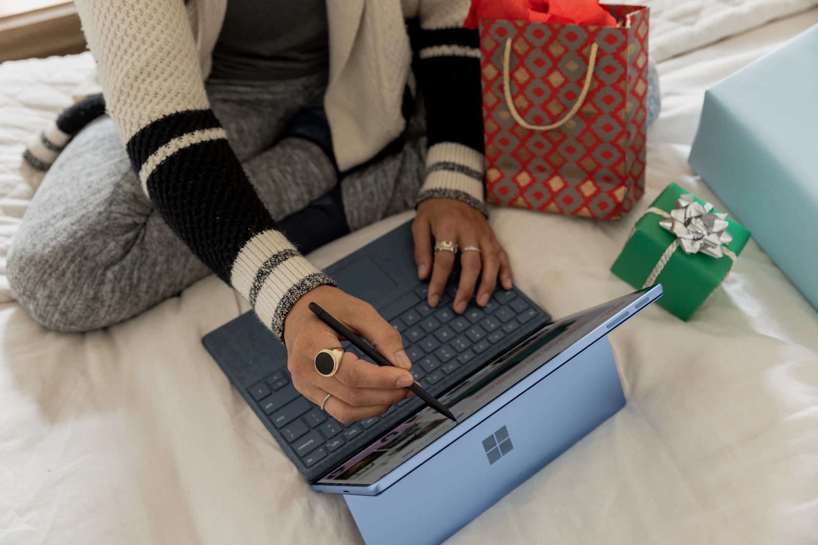 Flexible working with a laptop and stylus Person working on an online shop using a laptop